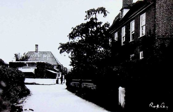 Black and white photograph of Gilbert Street, Ropley showing Hardings Stores and Bounty House